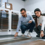 How can choosing a floor with subtle texture reduce the appearance of footprints in busy areas