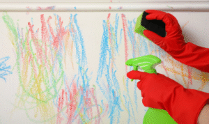 How can choosing a scrubbable paint in kids’ study areas make pencil and crayon marks less stressful?