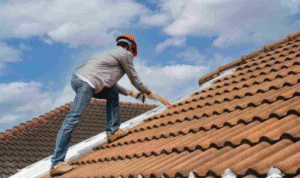 How can looking for standing water stains on parapet walls reveal how rain moves across the roof?