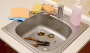 How can noticing gurgling sounds from drains alert you to early signs of blockage?