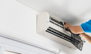 How can wiping air conditioner filters at home between professional services keep cooling more efficient?