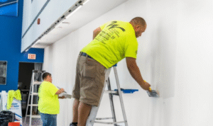 What benefit is there in planning one “maintenance painting week” every few years instead of waiting for major damage